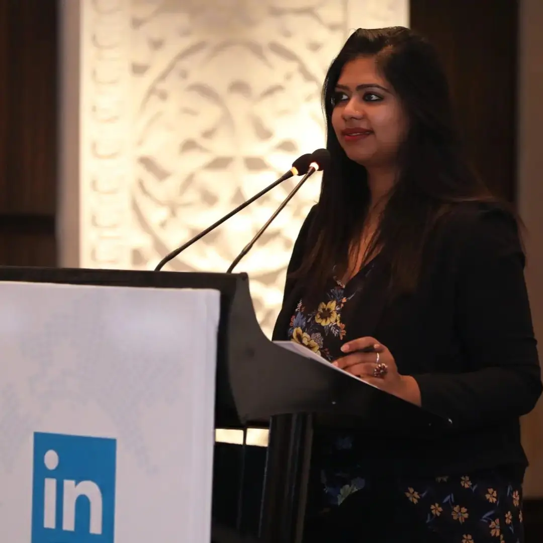 Sonali Mittra speaking at a professional event